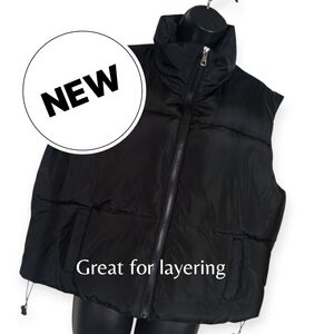 Puffer Vest. Orange Kiss. Black. Size: Women's XL.